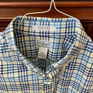 Crisp, pretty plaid in blues, white and yellow.  Button-down, long sleeve.